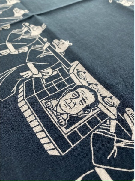 写真:事業の様子 渋沢栄一のイラストが入った手ぬぐい